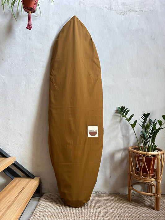 Brown canvas surfboard bag