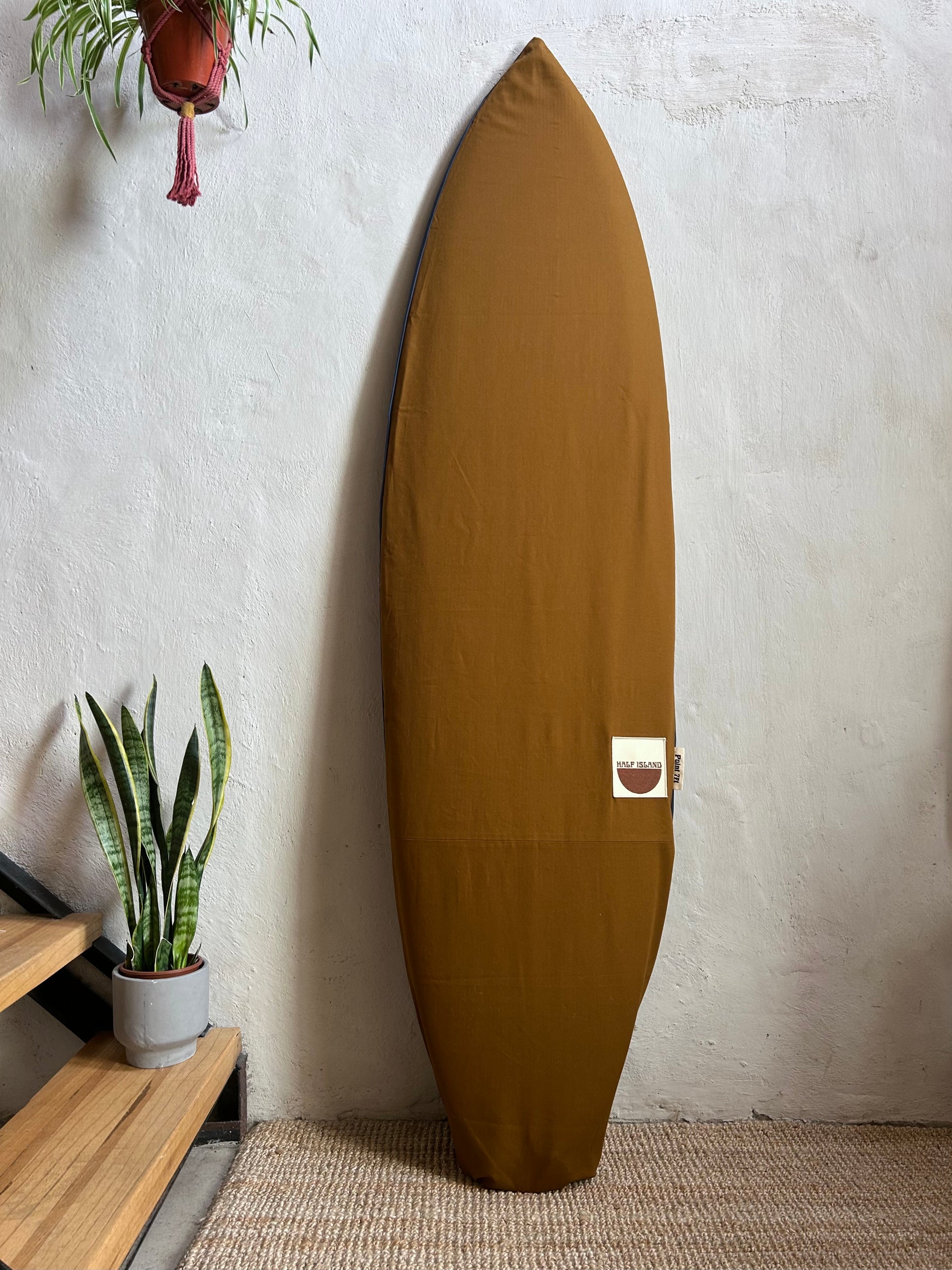 brown canvas surfboard bag